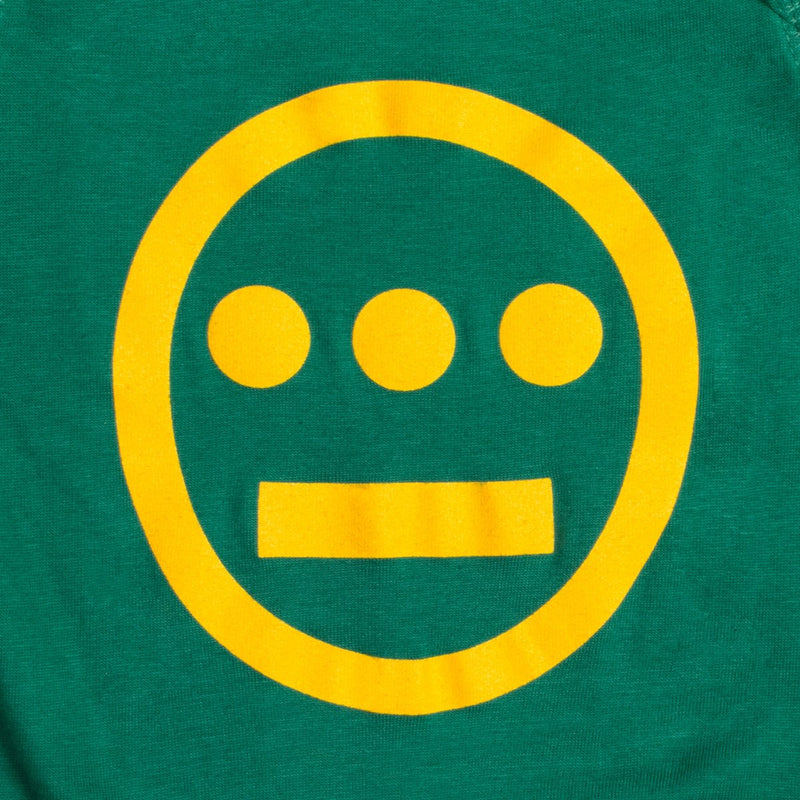 Close-up of large yellow Hiero hip-hop crew logo on a green infant one-piece.