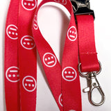 Detailed close-up of red quick release lanyard with white Hieroglyphics logo on repeat. 