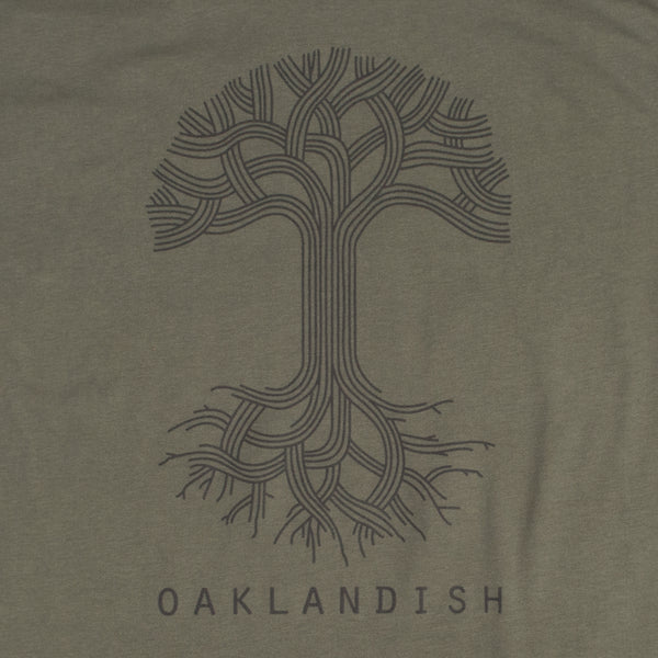 Close-up of a large black Oaklandish tree logo and wordmark on the chest of an army green t-shirt.