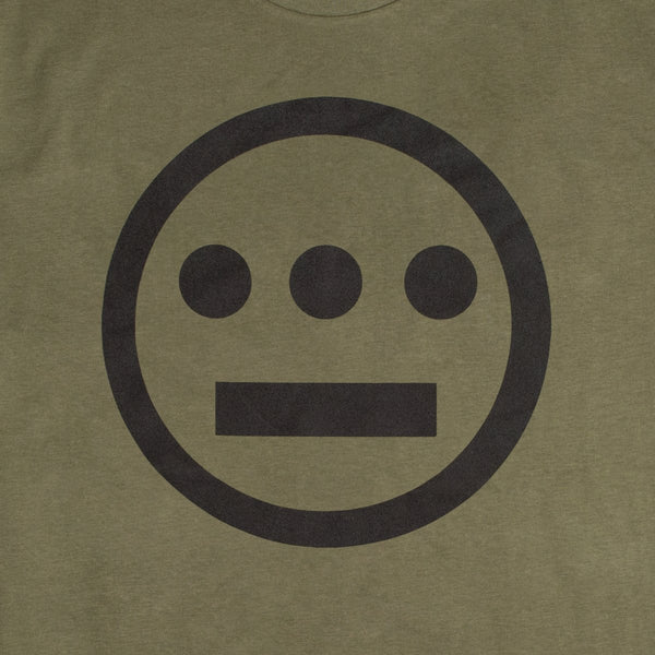 Close up of white Hieroglyphics Hip-Hop logo on an army green t-shirt.