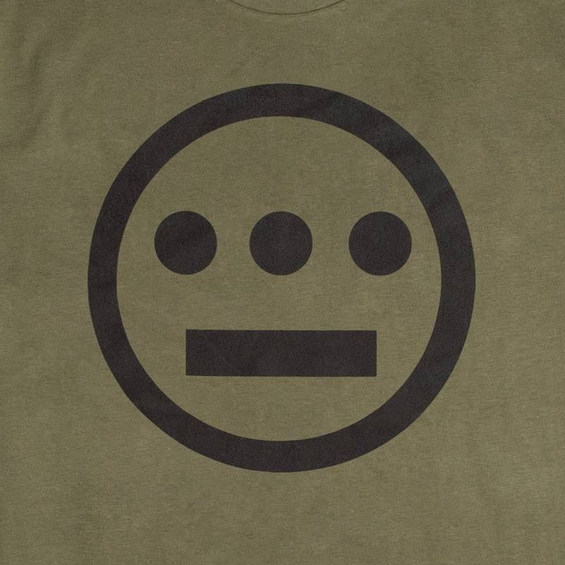 Close up of white Hieroglyphics Hip-Hop logo on an army green t-shirt.