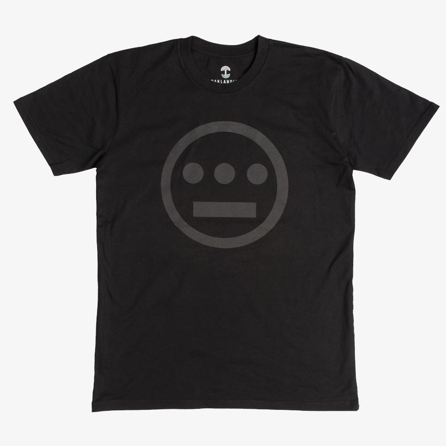 The Hieroglyphics Hiero Classic Logo Tee is a black T-shirt that showcases a subtle, dark gray logo of an outlined circle containing a horizontal line above three dots, resembling a hieroglyphic face. The logo is centrally placed on the chest area. This hip-hop-inspired T-shirt features a crew neck and short sleeves.