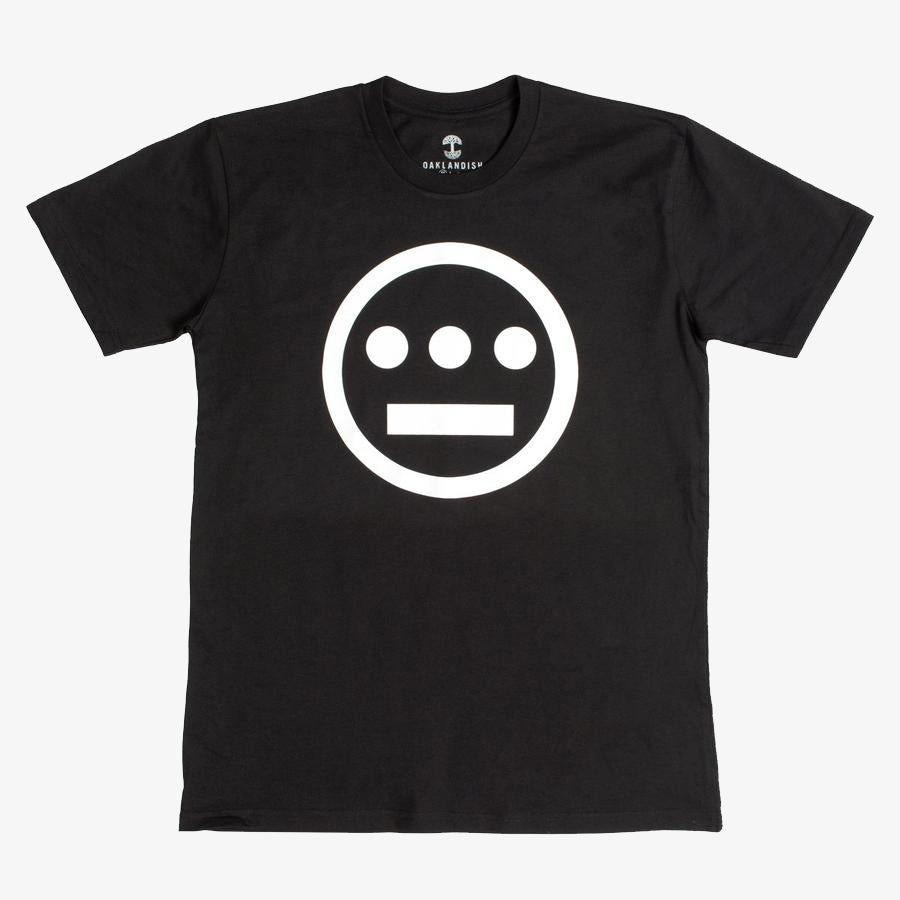 The Hiero Classic Logo Tee by Hieroglyphics is a black, classic fit T-shirt showcasing a simple, bold graphic on the front: a white circle with a horizontal line and three dots beneath it, evoking the iconic Hieroglyphics design. Featuring a crew neckline and short sleeves, this tee is displayed against a plain white background and is ideal for any hip-hop crew.