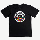 Black t-shirt with full-color, round Oakland Roots logo on the chest.