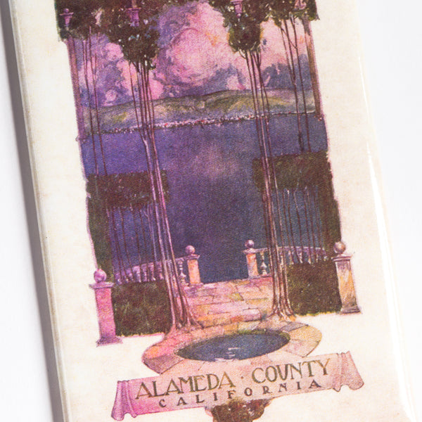 Close up of refrigerator Magnet saying Alameda County California with purple & pink classical pond view.