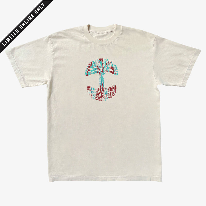 Creme t-shirt with large Oaklandish tree logo in indigo and red marbled ink on the chest.