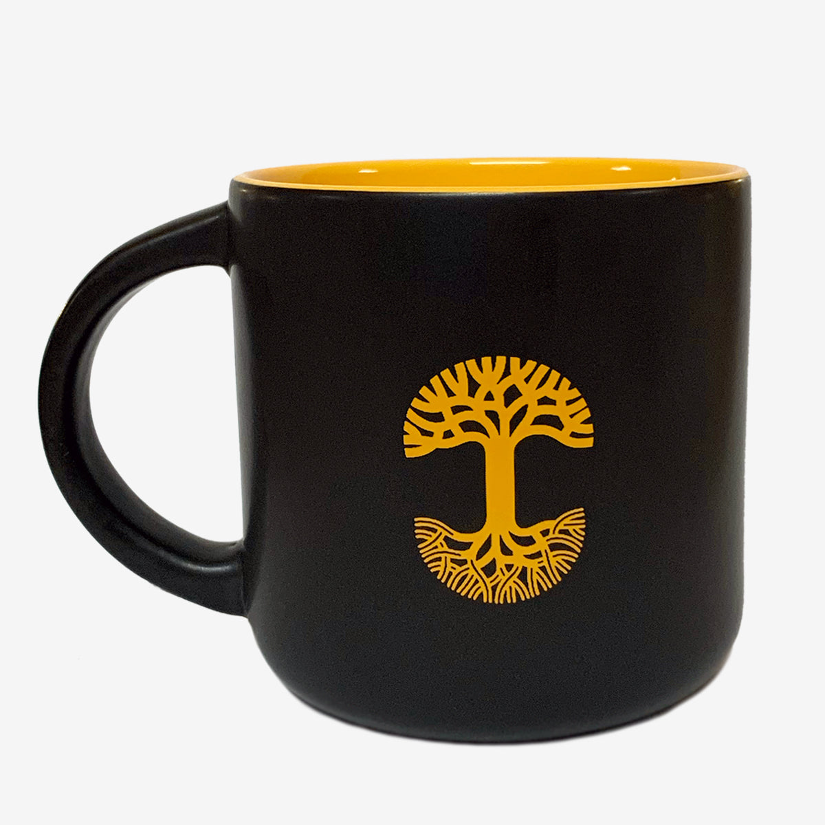 Black ceramic mug with yellow inside with yellow Oaklandish tree logo.