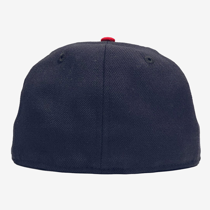The backside of a navy fitted cap.