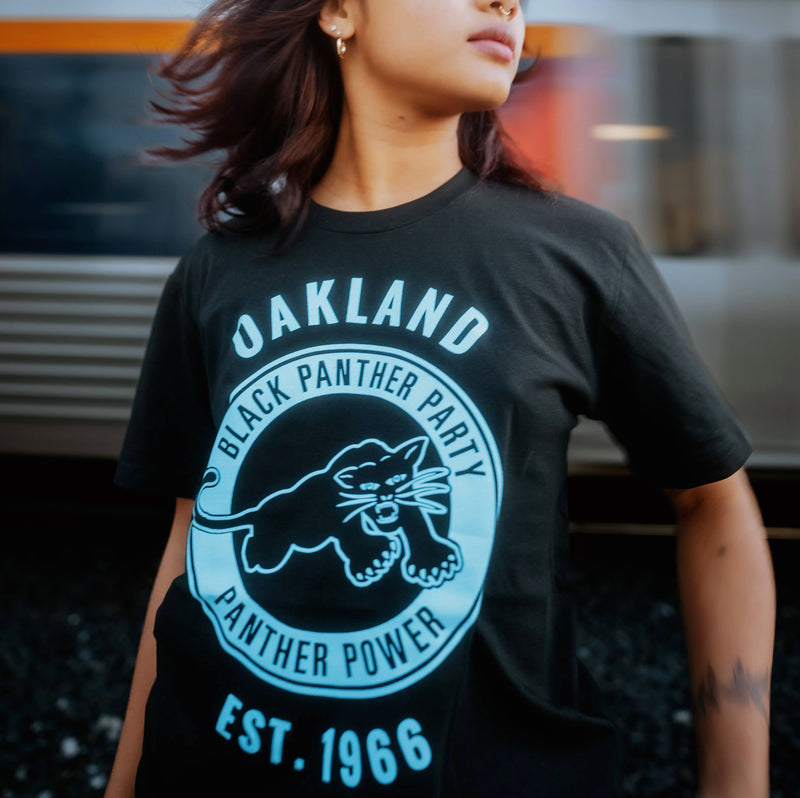Female model wearing Black Panther Power t-shirt.