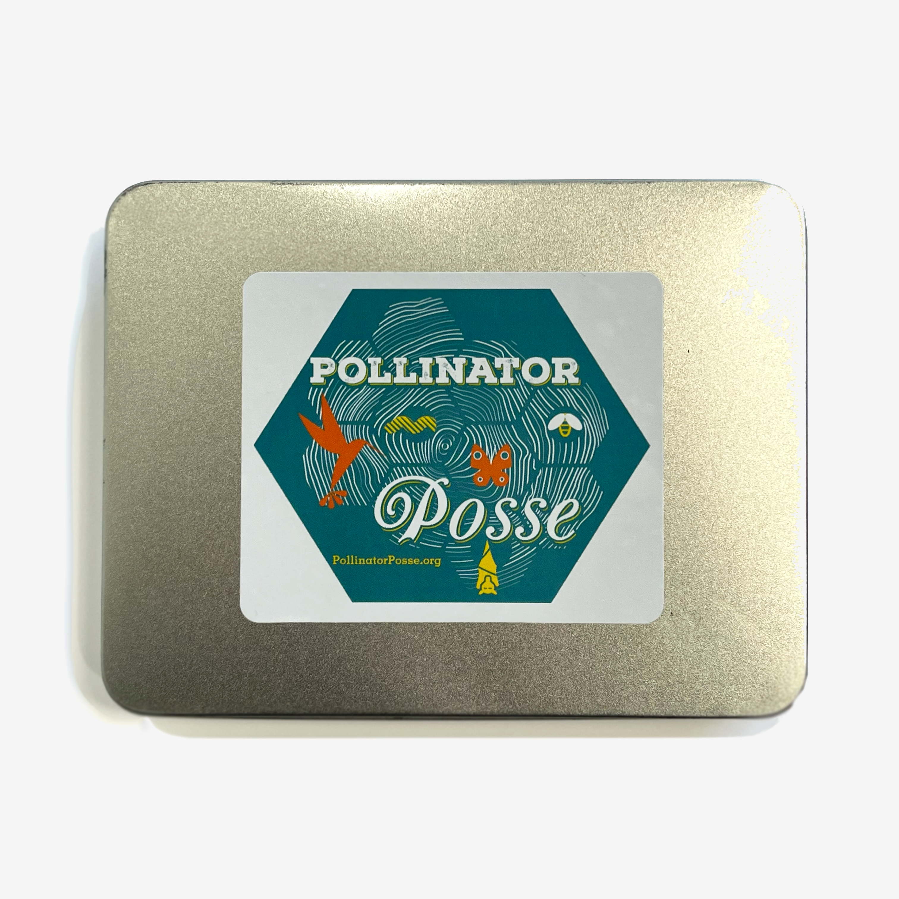 Top view of Pollinator Posse Seed Kit in metal box with a sticker label on the front.