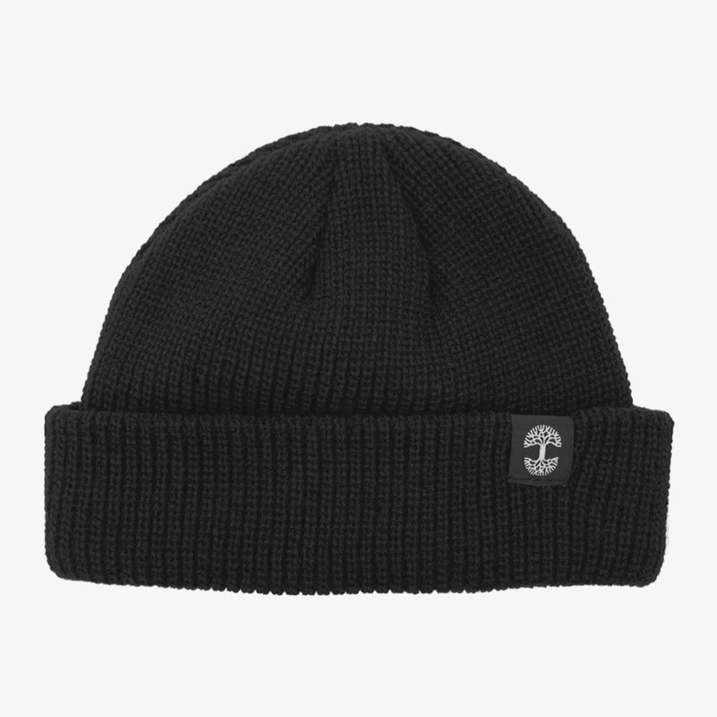 Shallow fit black cuffed beanie with black and white Oaklandish tree logo tag on the left wear side.  