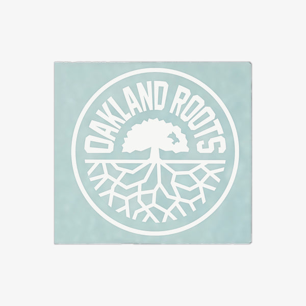 White circular Oakland Roots logo on a 6” in diameter car window decal sticker.