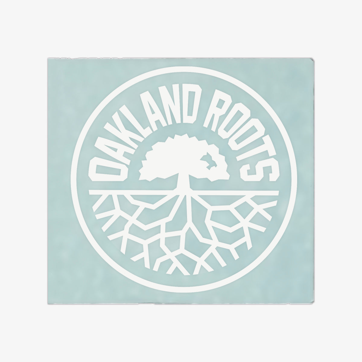 White circular Oakland Roots logo on an 8” in diameter car window decal sticker.