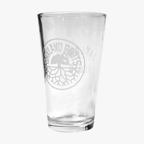  Beer pint glass with translucent white Oakland Roots logo crest.