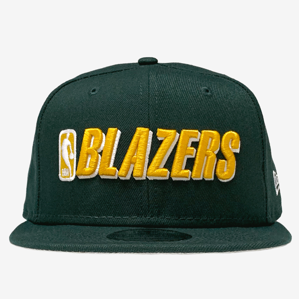 Green cap with embroidered gold BLAZERS and NBA  logo on the crown. 