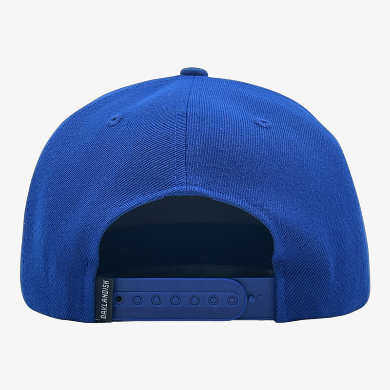 Back of royal blue cap with blue plastic snap back closure.
