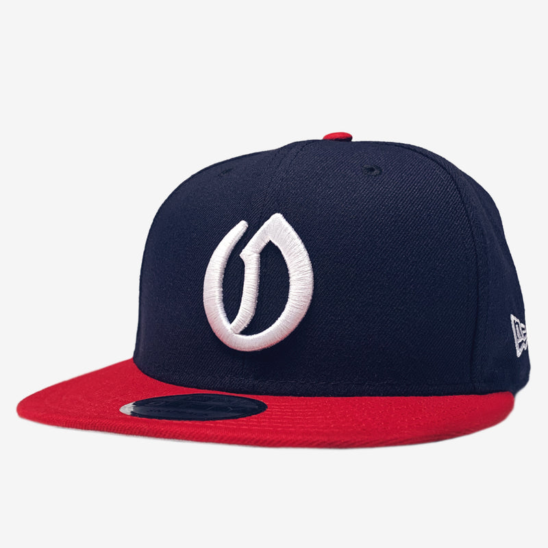 A navy New Era cap with a white embroidered A's O logo, a New Era sticker on the red bill, and a white New Era logo on the side.