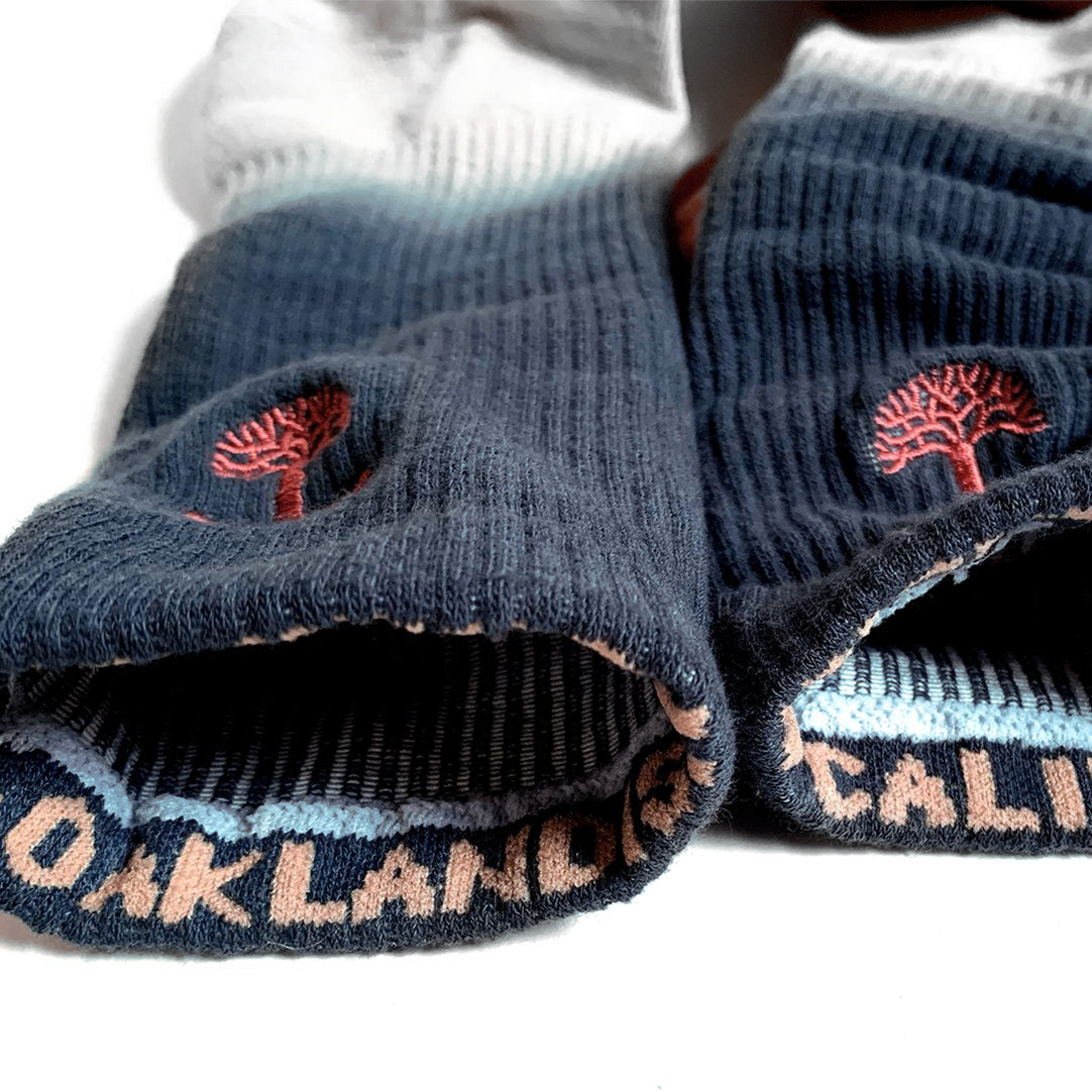 Close-up of the top of crew socks insides to expose the Oaklandish & California wordmarks - on each of the rims. 