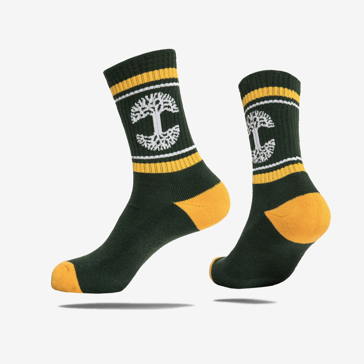 Forest green crew socks with yellow heel and toe and white Oaklandish tree logo between yellow and white ankle stripes.