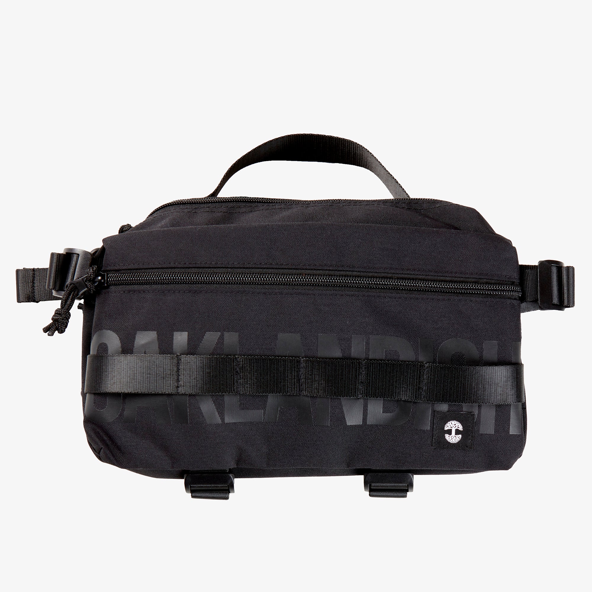 A black nylon hip bag with a black Oaklandish wordmark, front zipper, top handle, waist belt, & small white Oaklandish tree logo.