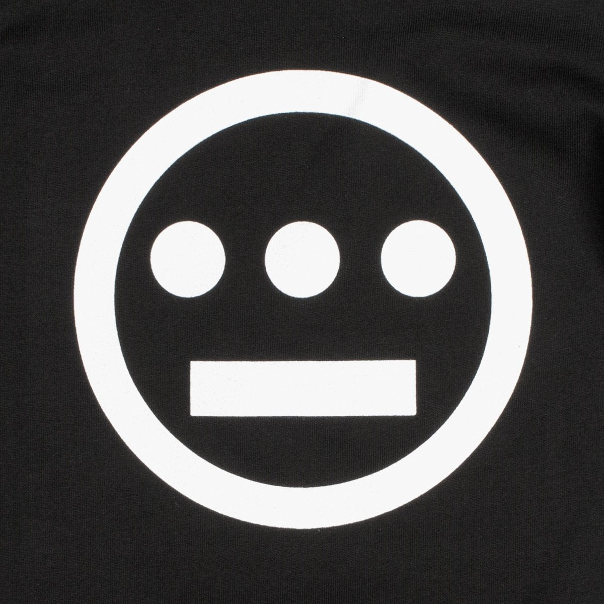 Close up of a white Hiero hip-hop crew logo on the chest of a black toddler t-shirt.
