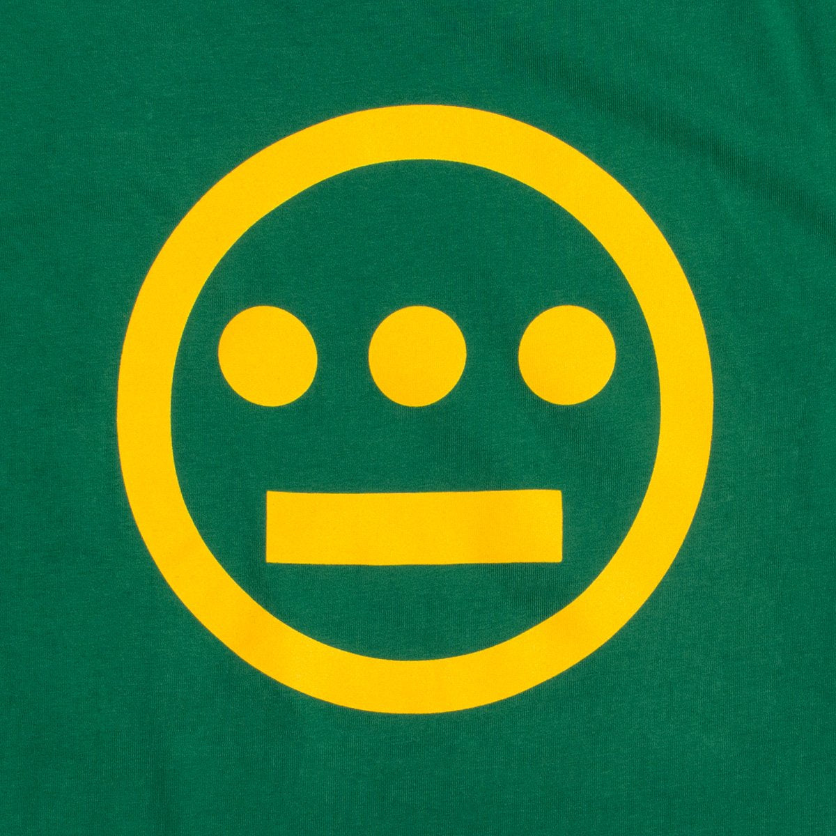 Close up of a yellow Hiero hip-hop crew logo on the chest of a green toddler t-shirt.