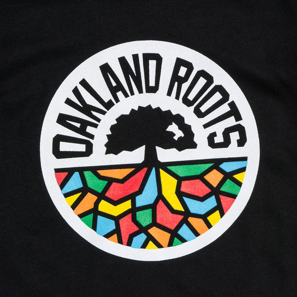 Close up on a full-color Roots SC logo on the chest of a black toddler’s t-shirt.