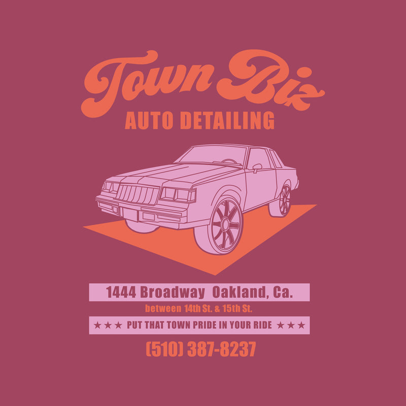 Close-up of Town Biz Auto Detailed ad with car and “Put that Town Pride in Your Ride” tagline on berry red t-shirt.