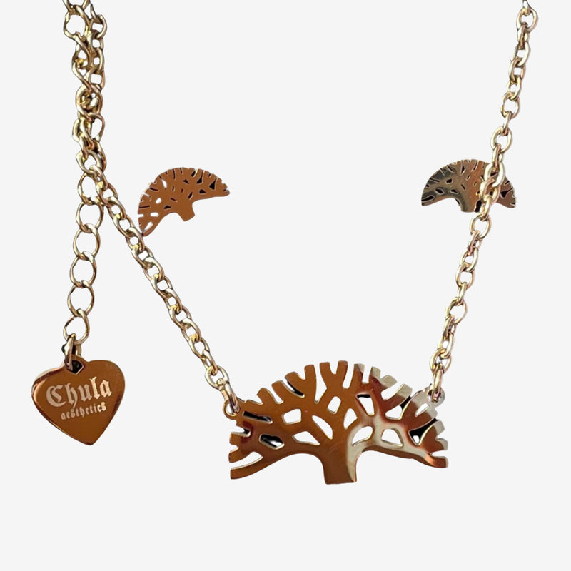 Brass chain necklace with three Oakland trees and heart with Chula Aesthetics wordmark.