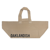 Extra wide natural colored bull denim shopping tote bag with black Oaklandish wordmark.