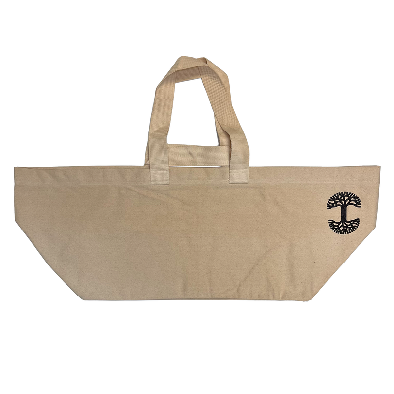 Extra wide natural colored bull denim shopping tote bag with Oaklandish tree logo at top corner of bag.