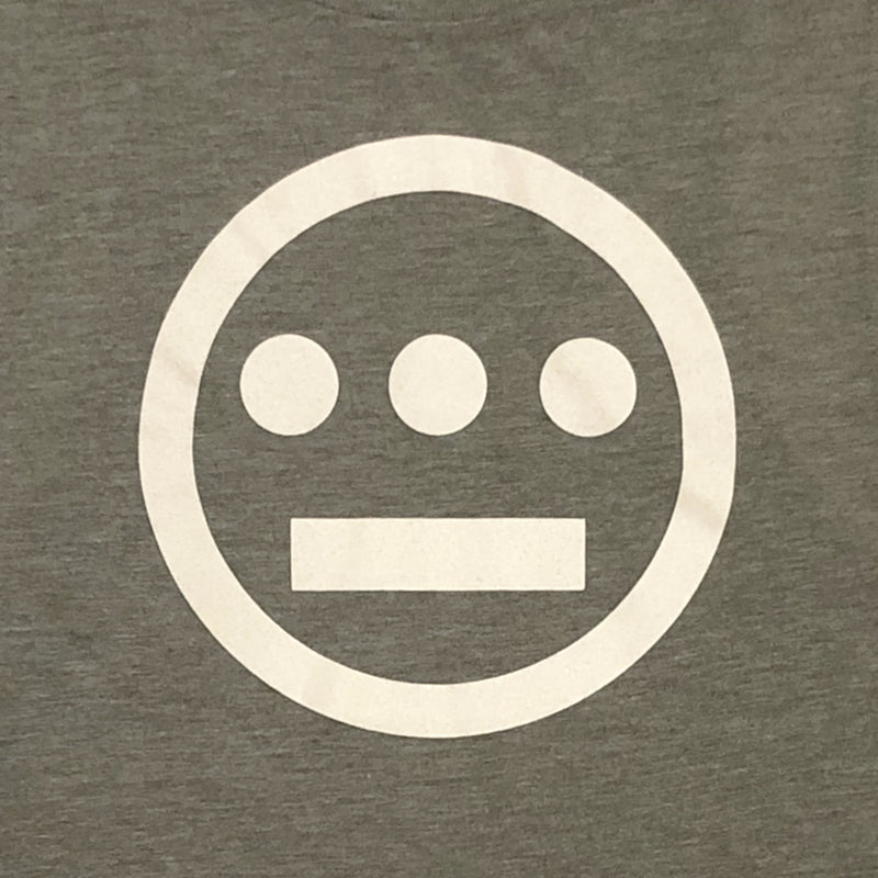 Close-up of creme Hiero Hip Hop Crew Classic Logo on the chest of a women’s olive green tank top.