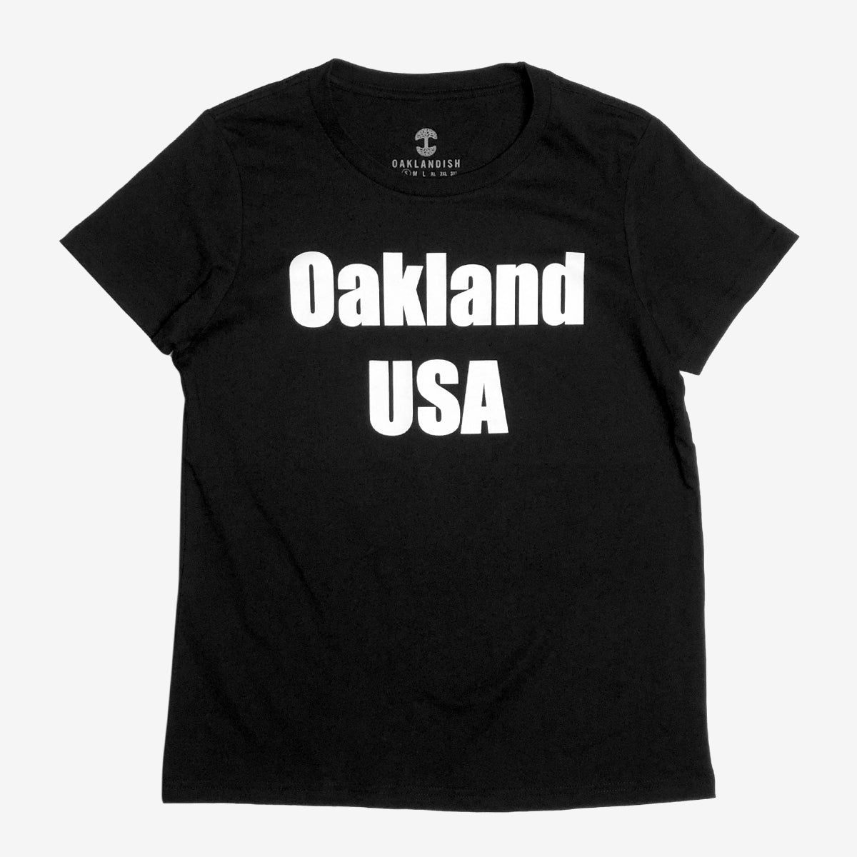 A women’s black t-shirt with a large white Oakland USA wordmark logo on the chest.