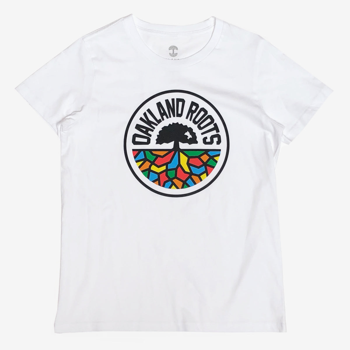 A white women’s cut t-shirt with a full-color Roots SC logo on the chest.