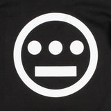 Close-up of white Hiero hip-hop crew logo on the chest of a black youth sized t-shirt.