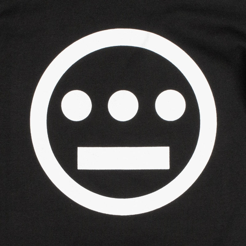 Close-up of white Hiero hip-hop crew logo on the chest of a black youth sized t-shirt.