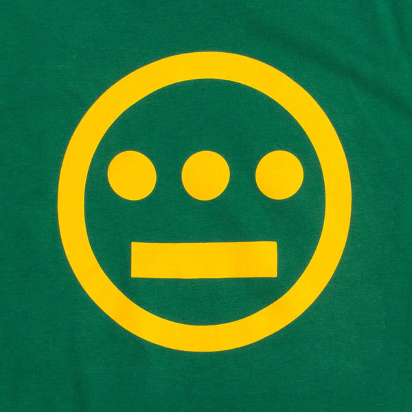 Close-up of yellow Hiero hip-hop crew logo on the chest of a kelly green youth sized t-shirt.