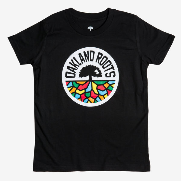 Black youth t-shirt with full-color Roots circle logo on the chest.